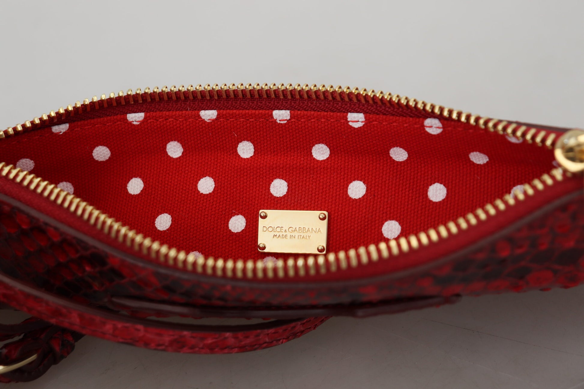 Elegante rote Leder-Clutch in Ayers Snake-Optik