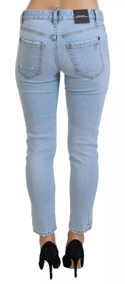 Blaue, zerfetzte, verkürzte Twiggy-Jeans aus Denim mit mittlerer Taille